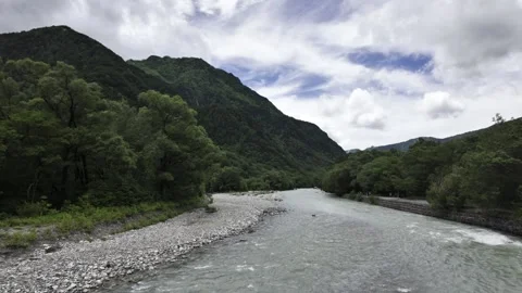 Rapid White River Under Wooden Suspension Bridge Stock Footage 332094804