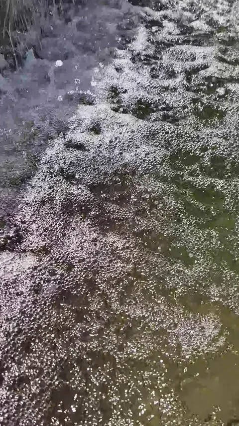 Rapidly Bubbling Water Surface Churning with White Foam Texture Stock Footage 339080086