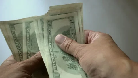 Rapidly Counting Stack Of Hundred Dollar Bills Then Tossing On Ground Video stock 247418745