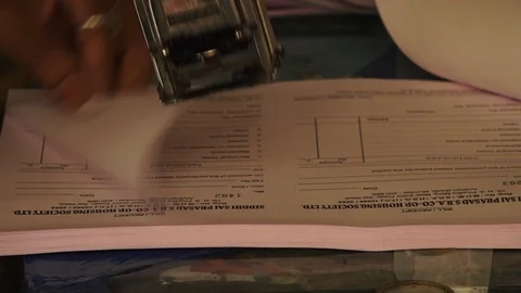 Rapidly stamping various documents Stock-Footage 94701481
