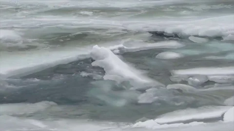 Rapids and Ice along the upper Matanuska River and Mountains during winter Stock Footage 84708507