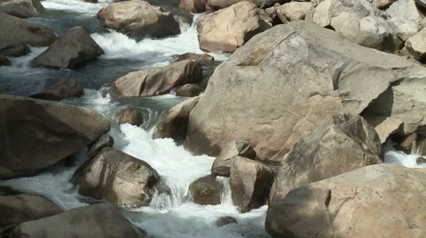 Rapids on Fast Flowing Sierra Mountain Stream during Snow Melt Runoff Stock Footage 54715317