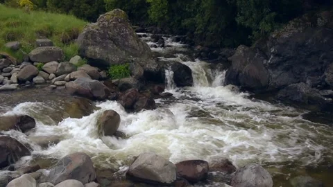 Rapids flowing over large rocks in the Waihi River, New Zealand. Stock Footage 136064953