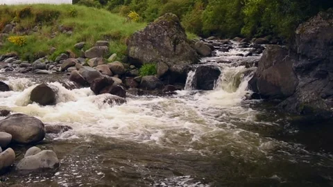Rapids flowing over large rocks in the Waihi River, New Zealand. Stock Footage 136997921