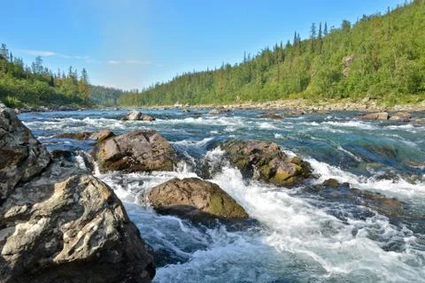 The rapids on a Northern river. Stock Photos
