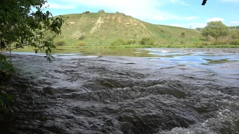 Rapids on the river. Strong water current. Slow motion 240 fps Stock Footage 124734305