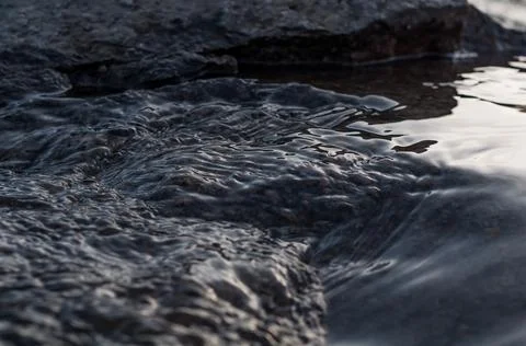 Rapids small river, strong current water flowing among stones, beautiful natu Stock Photos