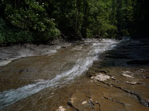 Rapids in stream as camera moves up stream Stock Footage 77167762
