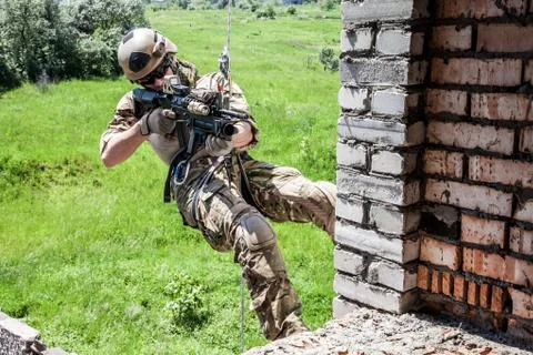 Rappeling with weapons Stock Photos