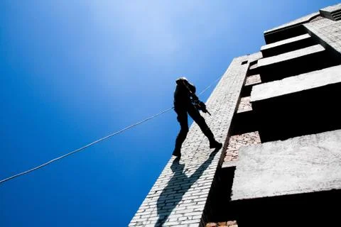 Rappeling with weapons Stock Photos