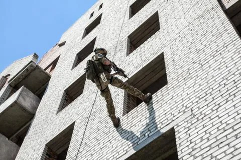 Rappeling with weapons Stock Photos