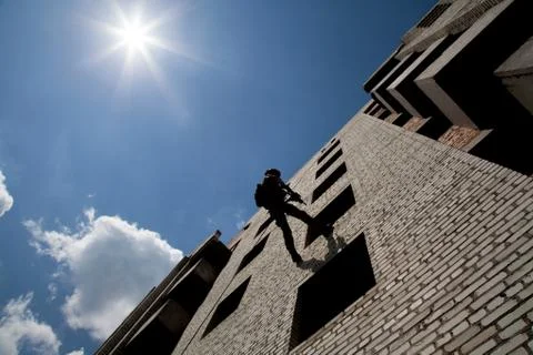 Rappeling with weapons Stock Photos