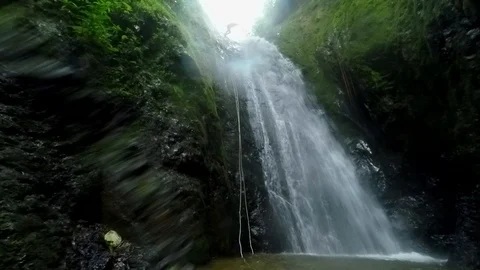 Rappelling a waterfall, Banos, Ecuador 스톡 동영상 128436703