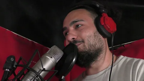 Rapper close up on mic spitting bars. Stock Footage 114022240