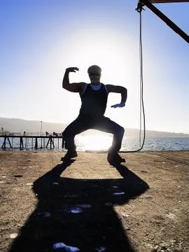 Rapper posing back light Stock Photos