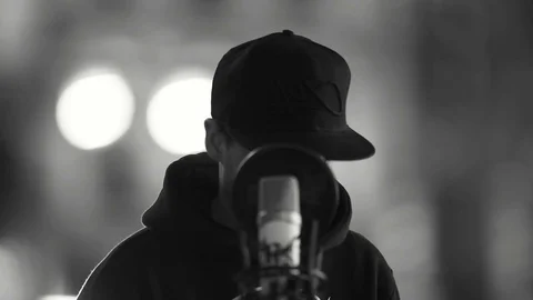 Rapper posing behind his microphone Stock Footage 80444828