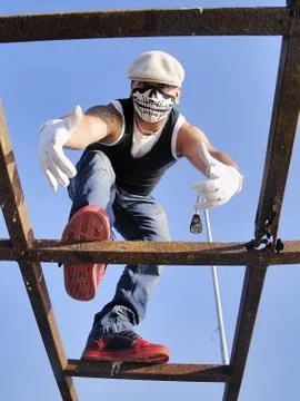 Rapper posing on a structure 3 Stock Photos