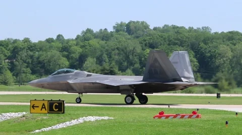 Raptor on runway.m4v Video stock 64255009