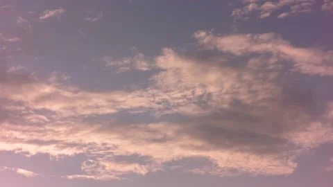 Rare clouds float across the sky and shimmer in the sunlight. Time laps. Stock Footage 142081633