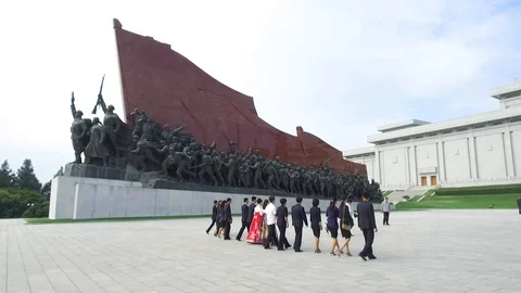 Rare footage of locals visiting monuments Mansu Hill, Pyongyang, North Korea  Stock Footage 128494834