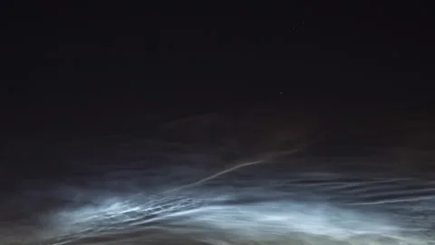 Rare noctilucent clouds illuminating the night sky Stock Footage 341287908