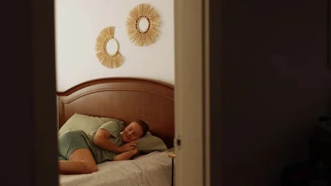Rare shooting point through a door frame young woman having nap, beautiful woman Stock Footage 252011935