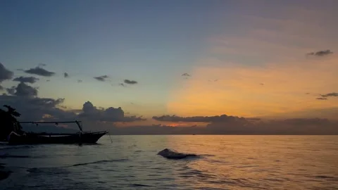 Rare Split Sky Sunset Phenomenon Over Sea with Boat Silhouette Stock Footage 335600225