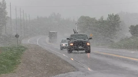 Rare spring snow storm over farm country 库存影片 154863913