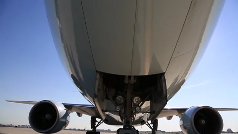 Rare View of a Push Back Tug (Trailer), Pushing a Wide Body Jet (Part 1). Stock Footage 219690455