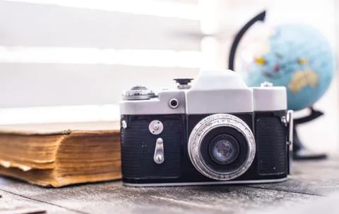 Rarity camera zenit with globe on the background Stock-Fotos