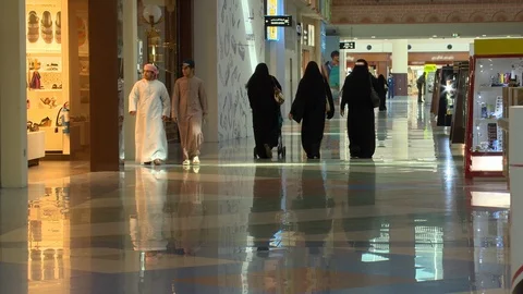 RAS AL KHAIMAH UAE - CIRCA NOVEMBER 2015: Arabs walking in a mall in local dress Stock Footage 96245704