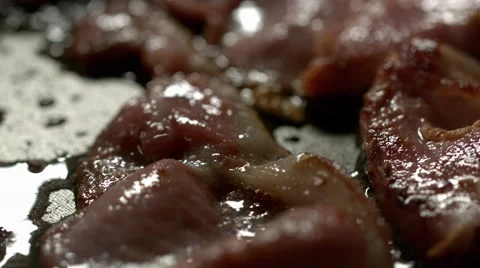 Rashers of bacon frying in a pan. Slow Motion. Stock Footage 41203424