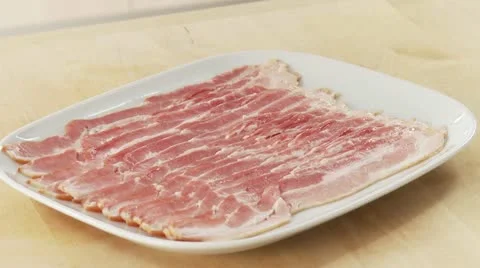 Rashers of bacon on a plate Stock Footage 24635853