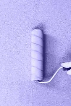 Rasit hand wall paint using a paint roller while working indoors Stock Photos