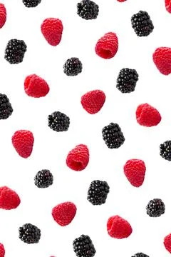 Raspberries abstract background. Fruit pattern of colorful wild berries isolated Stock Photos