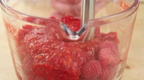 Raspberries being pureed Stock Footage 24650842