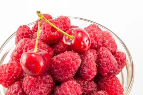 Raspberries with cherries Stock Photos