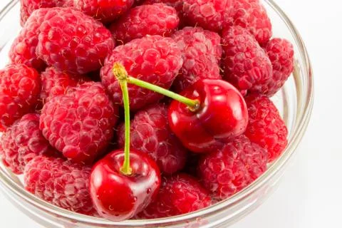 Raspberries with cherries Stock Photos