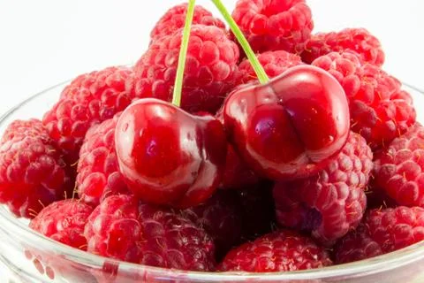 Raspberries with cherries Stock Photos