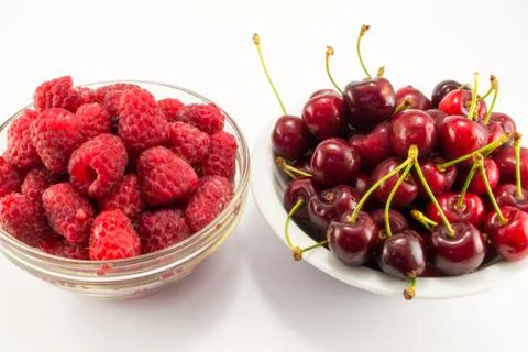 Raspberries with cherries Stock Photos