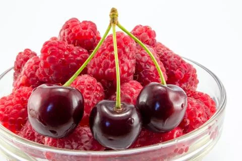 Raspberries with cherries Foto stock