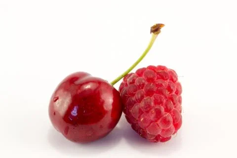 Raspberries with cherries Stock Photos
