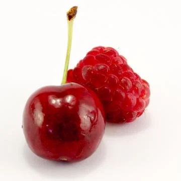 Raspberries with cherries Stock Photos
