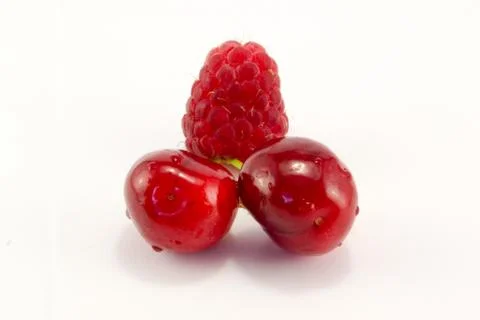 Raspberries with cherries Stock Photos