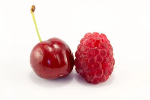Raspberries with cherries Stock Photos