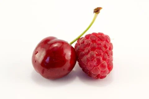 Raspberries with cherries Stock Photos