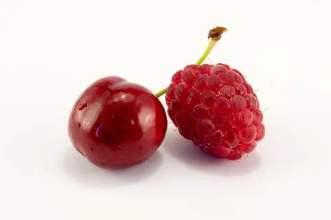 Raspberries with cherries Stock Photos