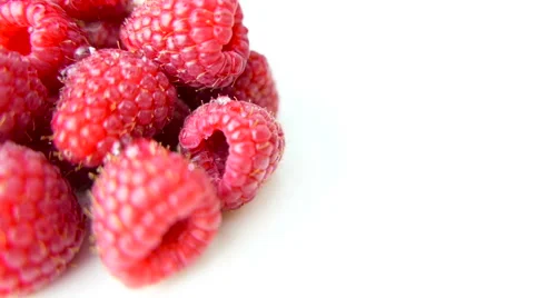Raspberries Closeup Rotating on White Background Stock Footage 62026409