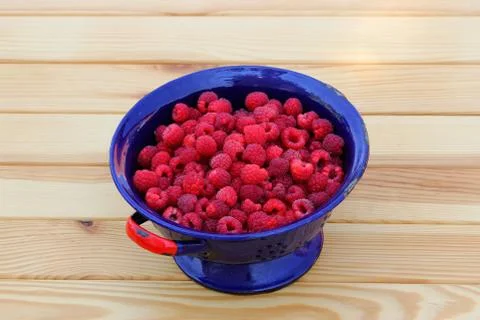Raspberries in colander 스톡 사진