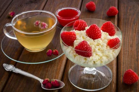 Raspberries on curd Stock Photos